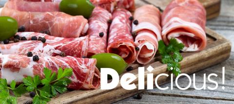 assortment of deli meats on a cutting board